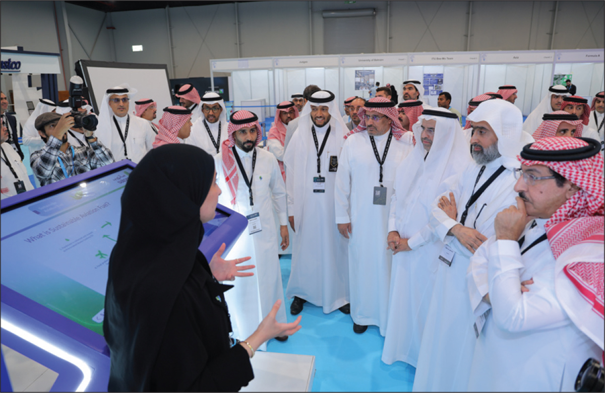  Advisory Committee Chairman Wail A. Al Jaafari, EVP Technical Services, Aramco (second from right) and others tour the exhibit floor.