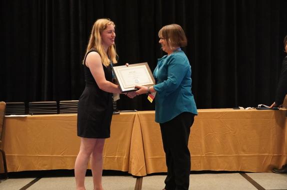 AIChE president Kimberly Ogden presented Jayme Currie with the John J. McKetta Undergraduate Scholarship award at the AIChE 2019 Annual Student Conference. 