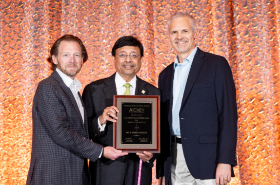 2024 AIChE President Alan Nelson (left), and The Dow Chemical Company's Dan Hickman (right) presented S. Shariq Yosufzai (center) with the F. J. and Dorothy Van Antwerpen Award at the 2024 Annual Meeting Honors Ceremony.