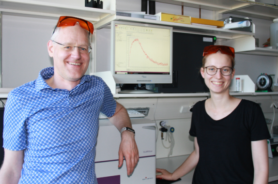 Dr. Andreas Möglich (left) in his lab alongside his graduate student Stefanie Meier (right). 