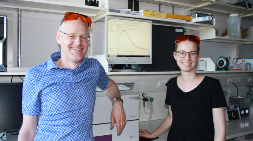 Dr. Andreas Möglich (left) in his lab alongside his graduate student Stefanie Meier (right). 