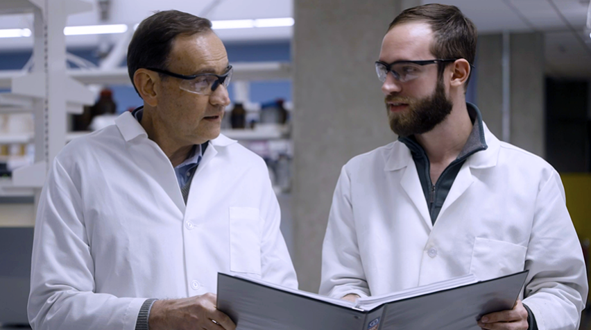 Fabio Ribeiro (left) consults with a colleague in his lab.